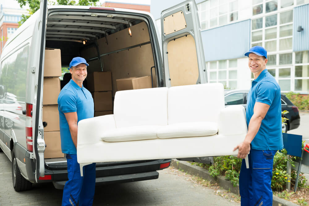 Team Of Van Nuys Movers Handling Heavy Boxes