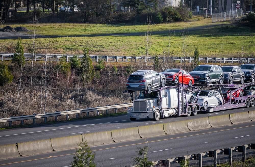 Auto Transport Driver Securing Vehicle Safely