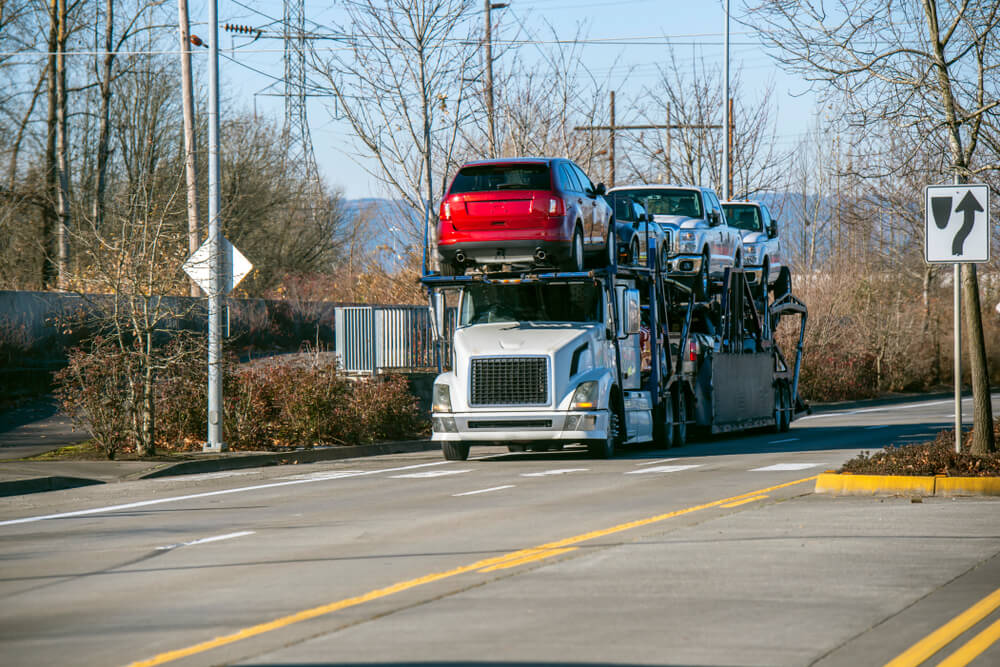 Open Car Carrier Transporting Several Cars